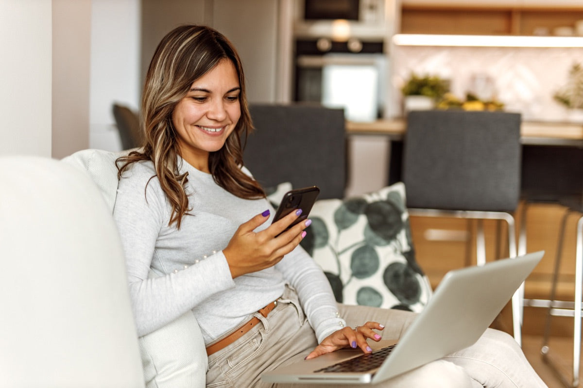 Girl smiling couch phone